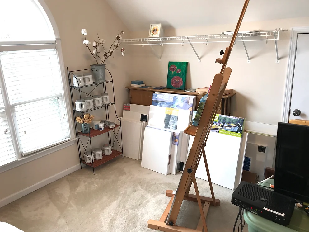 Art studio with empty shelving installed above supplies before full organizing by Imagine Organizing — Closet Organizing in Forest Park