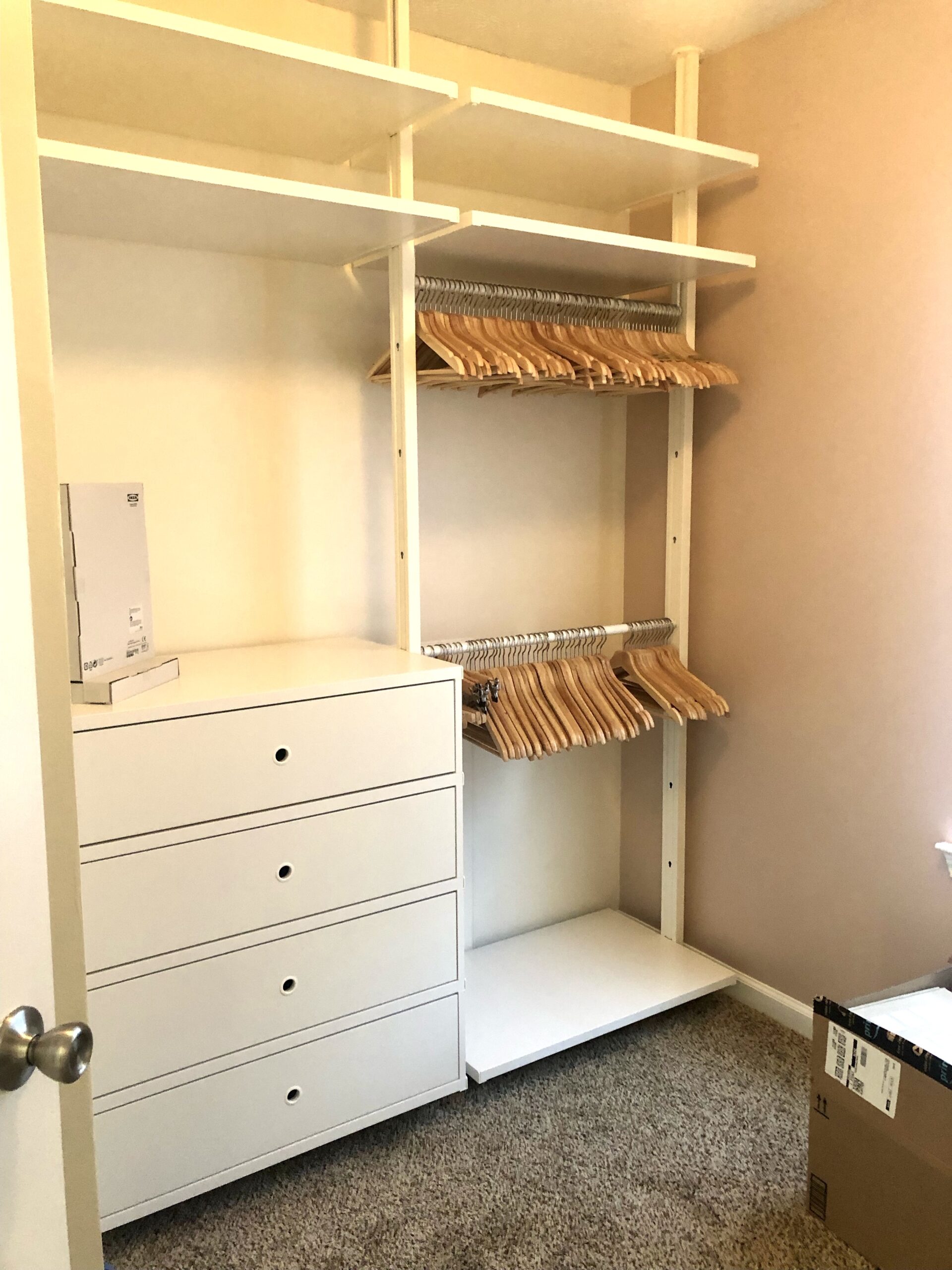 Custom closet shelving and hanging rods installed before styling by Imagine Organizing — Closet Organizing in Marietta